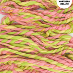 Handspun yarn in pink and green with 'Handspun in Northern Ireland' text overlay.