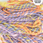 Multicolored handspun yarn with a label indicating 'Handspun in Northern Ireland'.