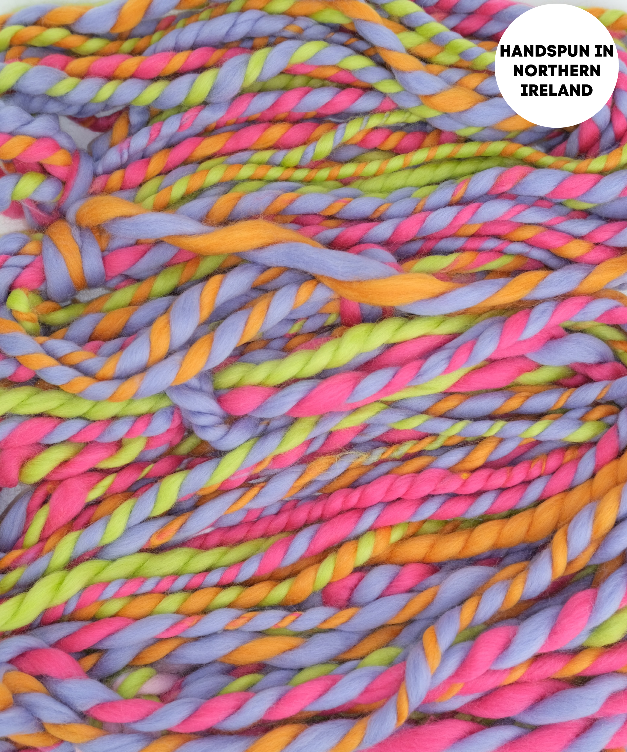 Colorful handspun yarn with a label indicating 'Handspun in Northern Ireland'.