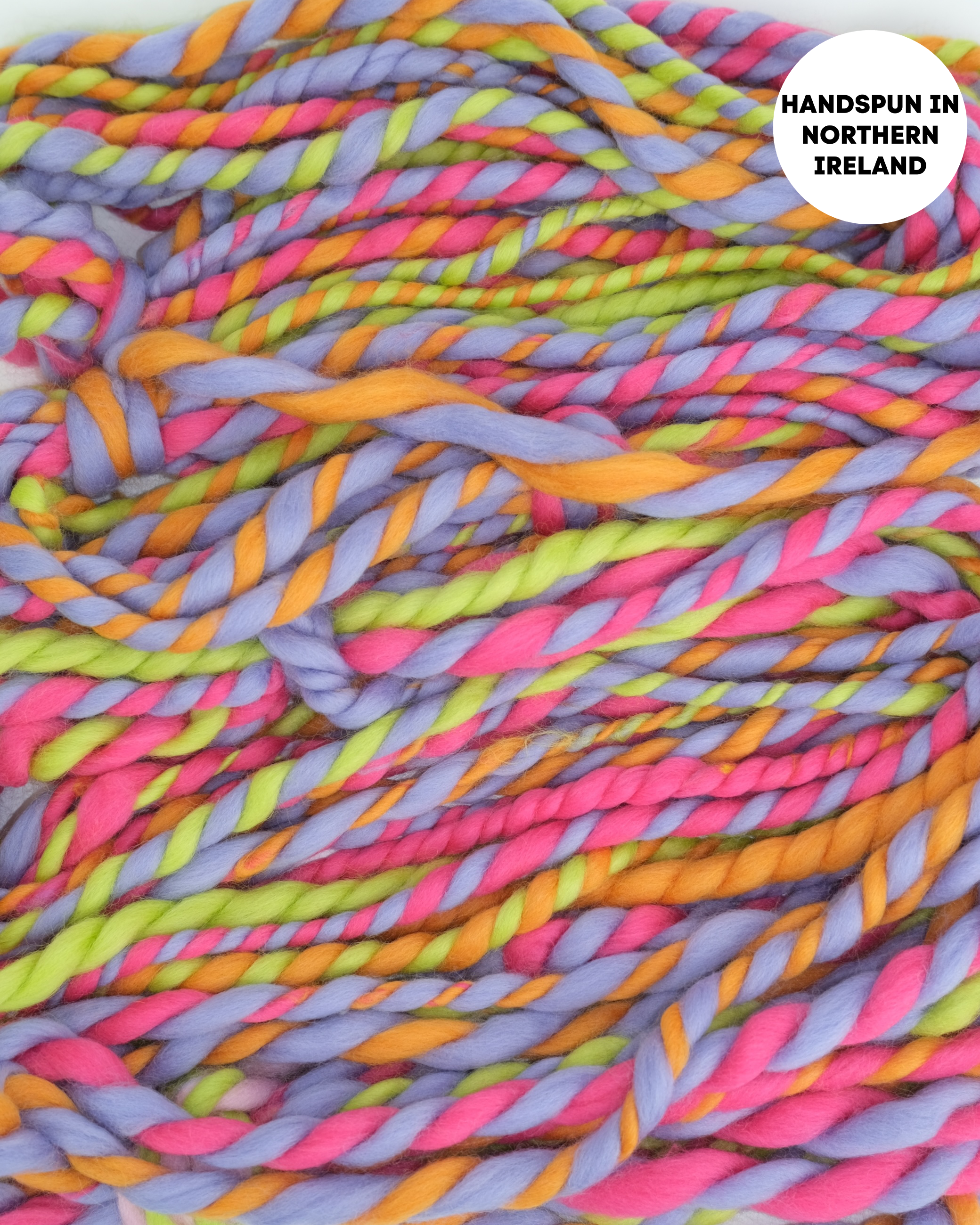 Colorful handspun yarn with a label indicating 'Handspun in Northern Ireland'.