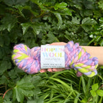 Braided yarn with a Hope's Wool label against a green leafy background