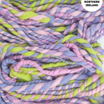 Handspun yarn in pastel colors with 'Hands spun in Northern Ireland' text.