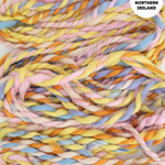 Pastel-colored yarn braid with 'Handspun in Northern Ireland