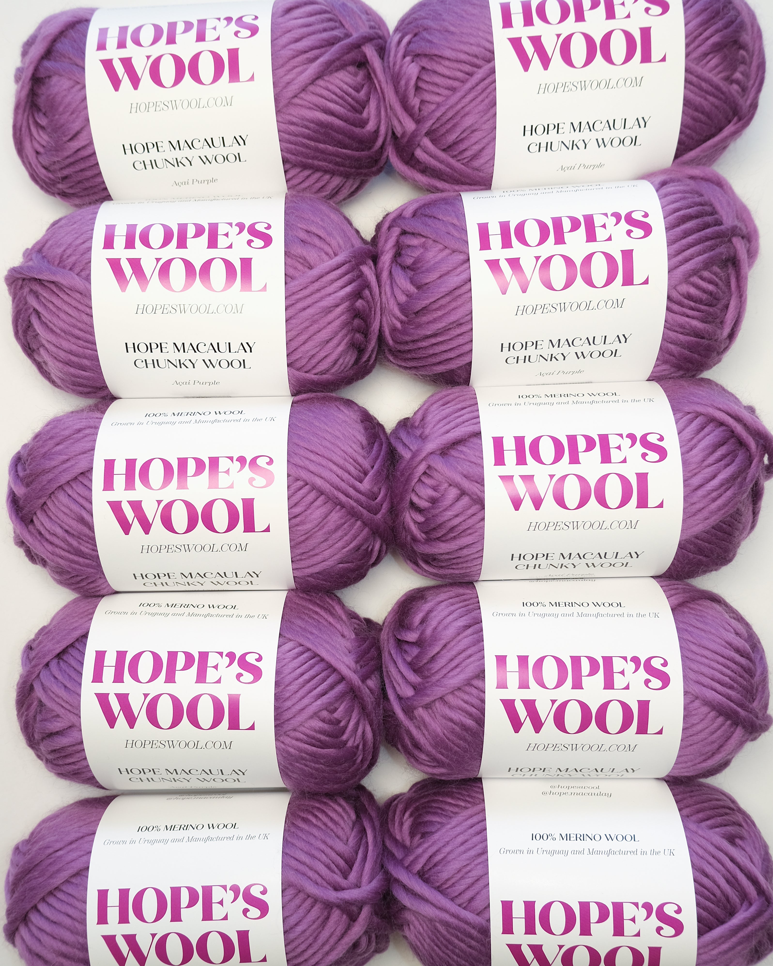 Multiple skeins of Hope's Wool chunky yarn in Açaí Purple – 100% Merino wool, grown in Uruguay and manufactured in the UK, ideal for hand knitting and DIY projects.