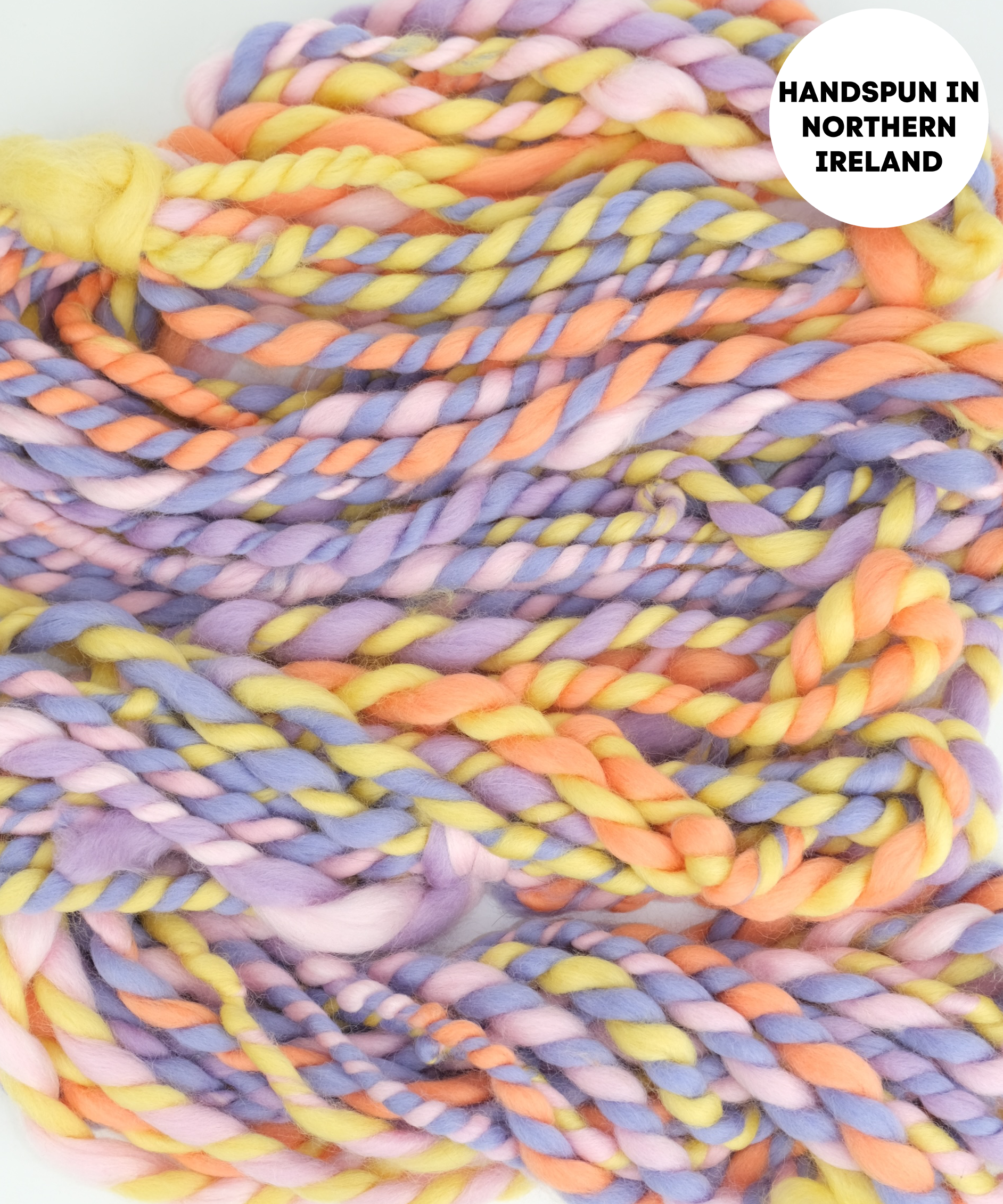 Multicolored handspun yarn with a label indicating 'Handspun in Northern Ireland'.