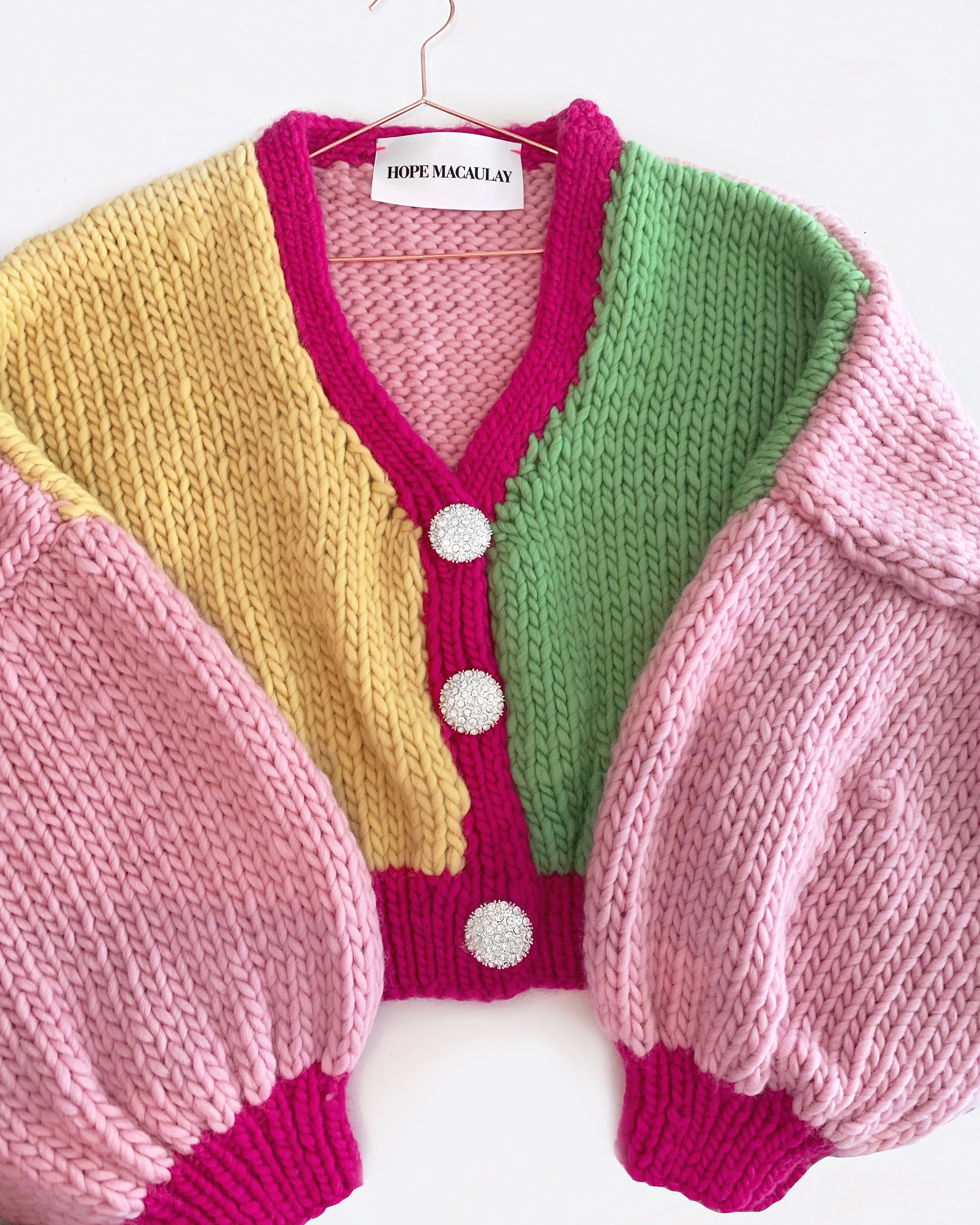 Pink, green, yellow and rose coloured cardigan with rhinestone buttons