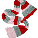 A colorful knitted scarf with red, pink, and grey stripes.