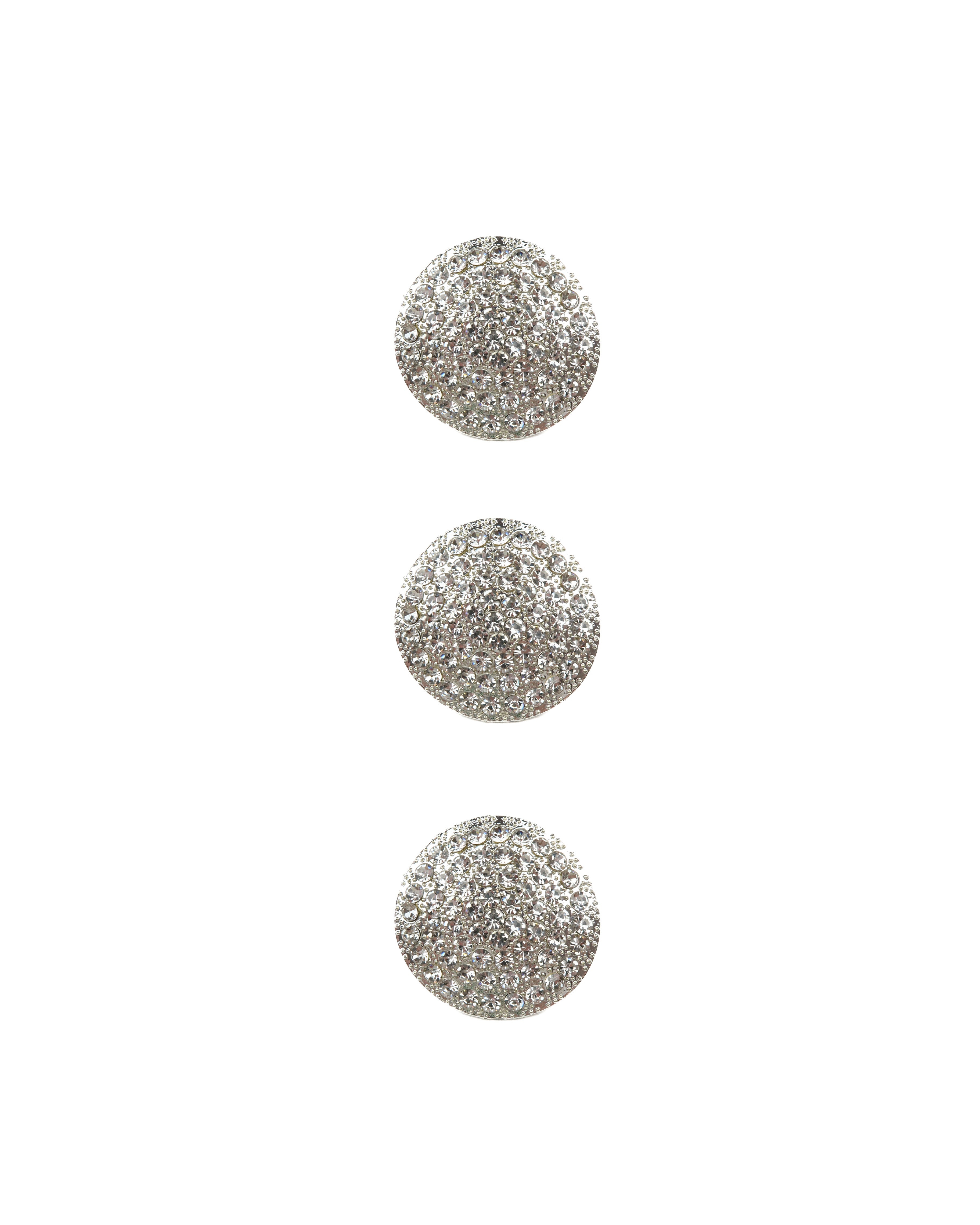 Three silver rhinestone buttons on a white background